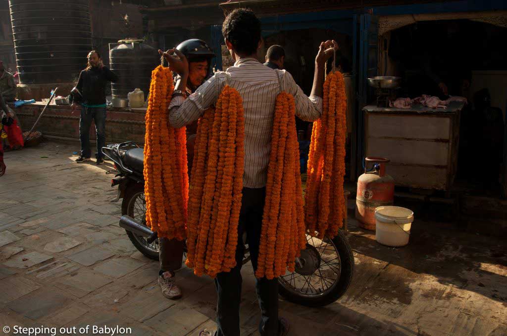 marigold garland seller during Tihar Festival. Kathmandu