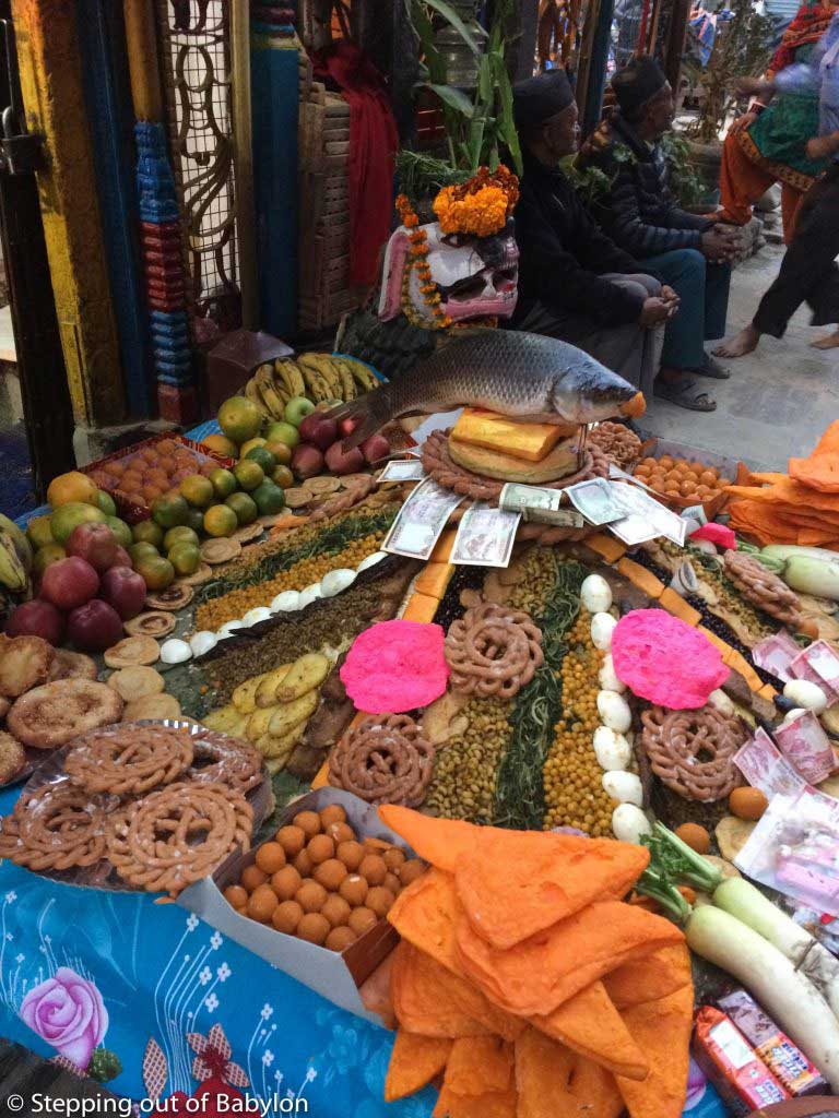 oferings of food piles in from of a small temple during Tihar Festival. Kathmandu