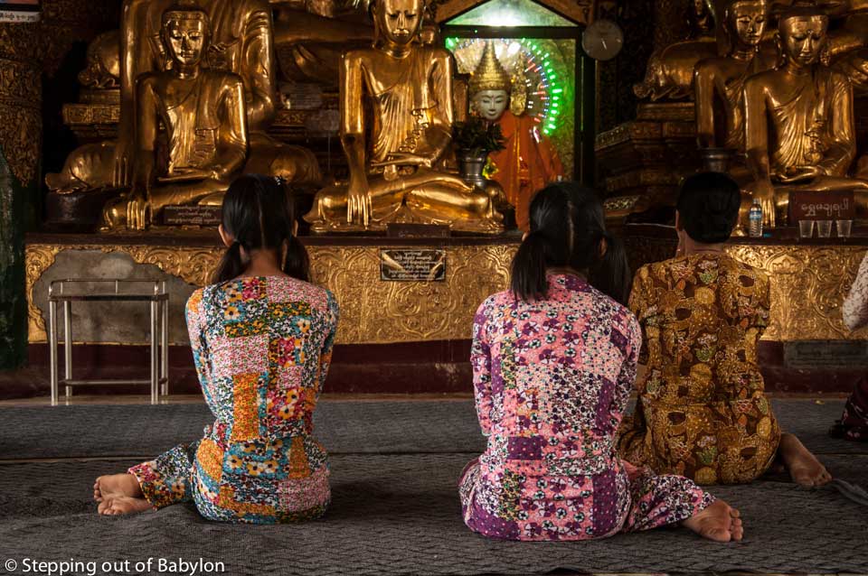 Praying at on of the temples of Shwedagon Pagoda