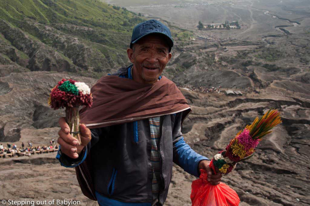 Selling flowers to trow to the Bromo crater to pacify the volcano