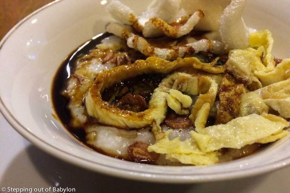 Bubur... a traditional Indonesia breakfast served at Six Degrees Hostel... a kind of rice porridge with a egg topping