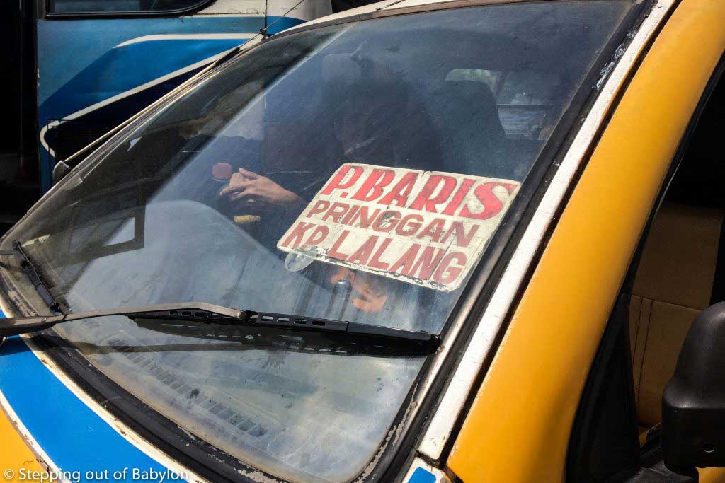 "angkot" that cross the city and drop you nearby the Pinang Baris Terminal, from where the bus to Bukit Lawang departure