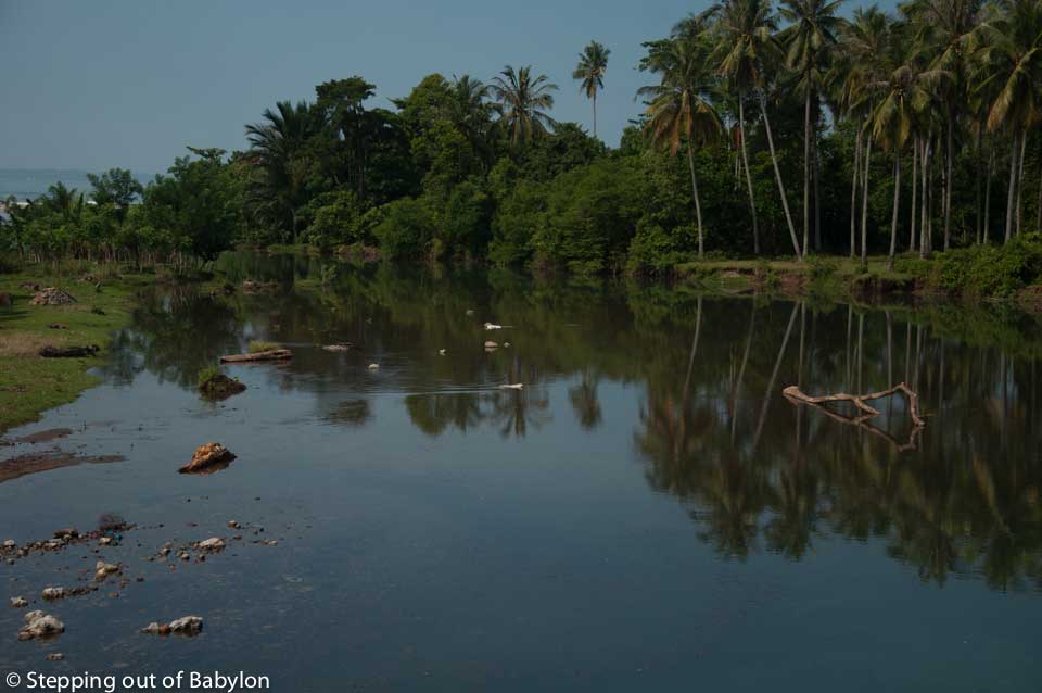 Crossing the road from Krui to Bintuhan there are many rivers surrounded by tropical forest